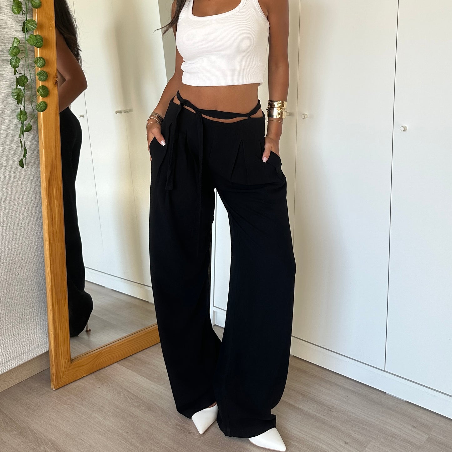 Black wide-leg pants with tie-waist detail