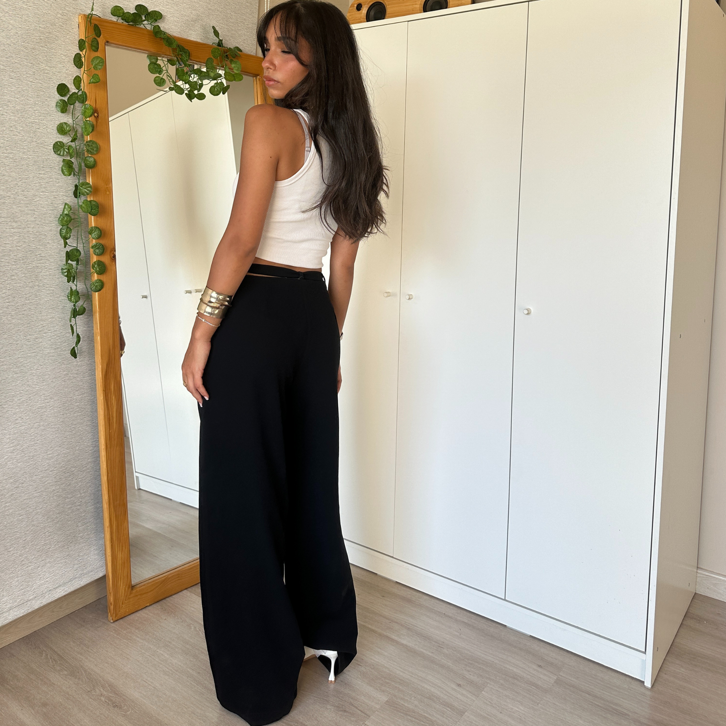 Black wide-leg pants with tie-waist detail