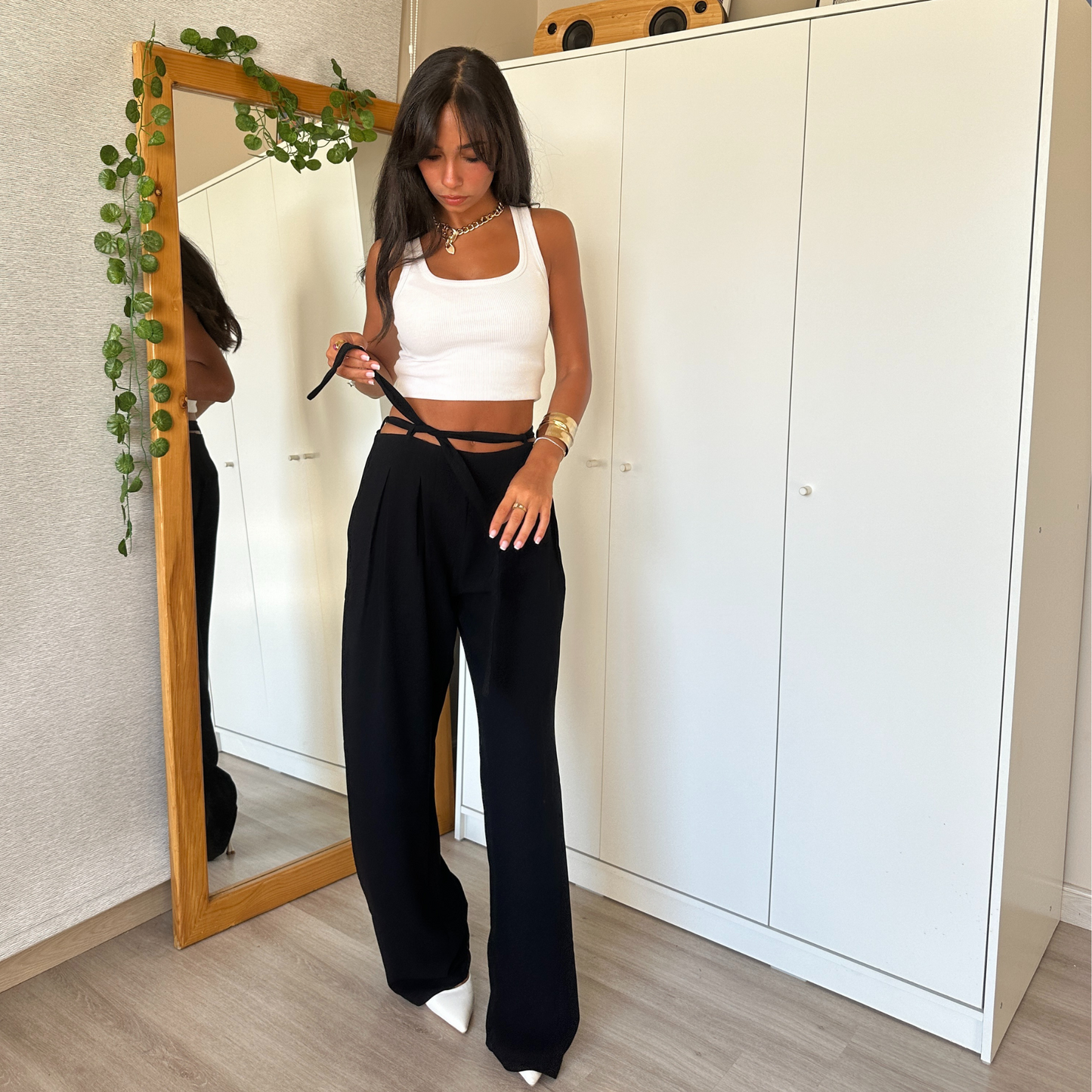 Black wide-leg pants with tie-waist detail