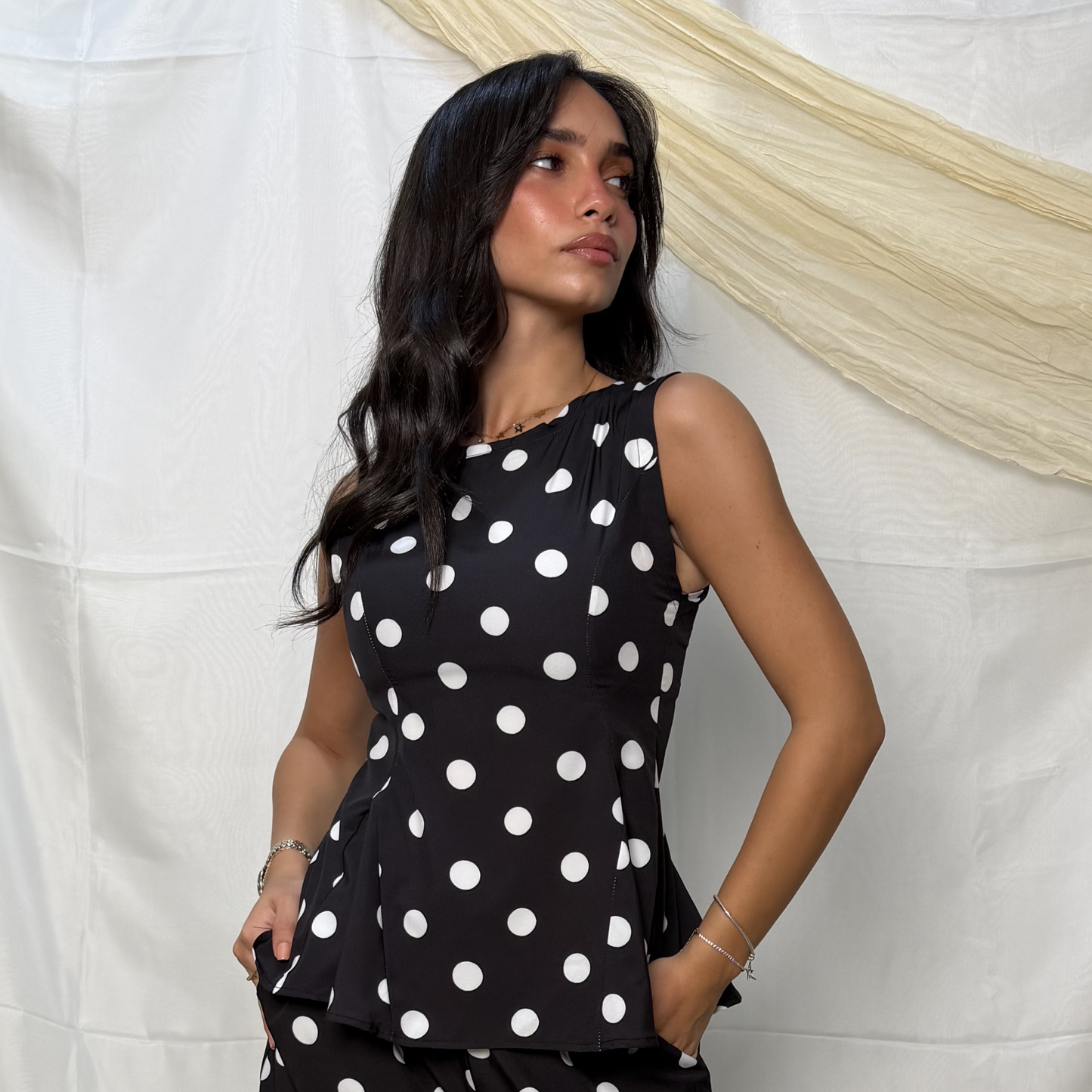 Sleeveless Polka Peplum Top