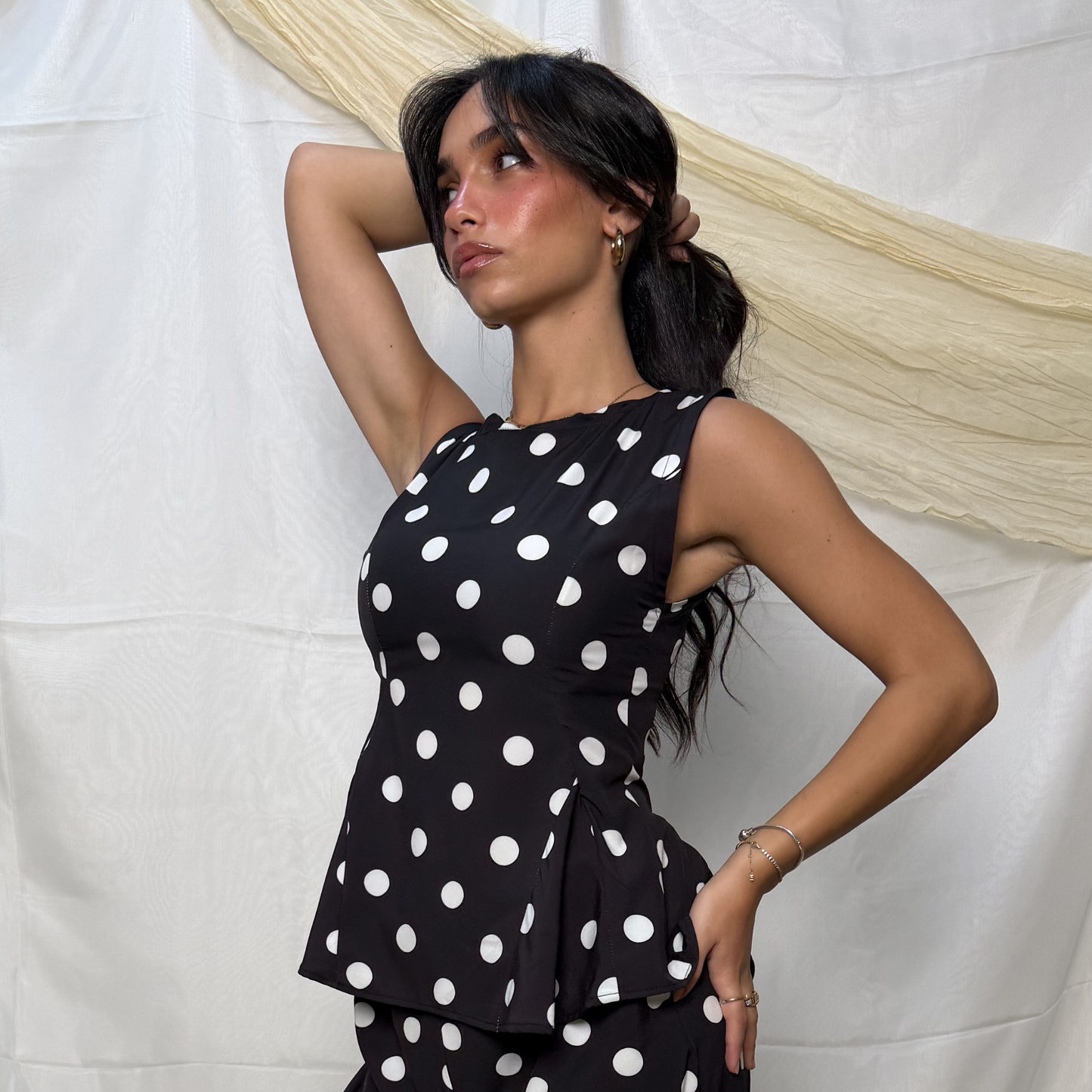 Sleeveless Polka Peplum Top